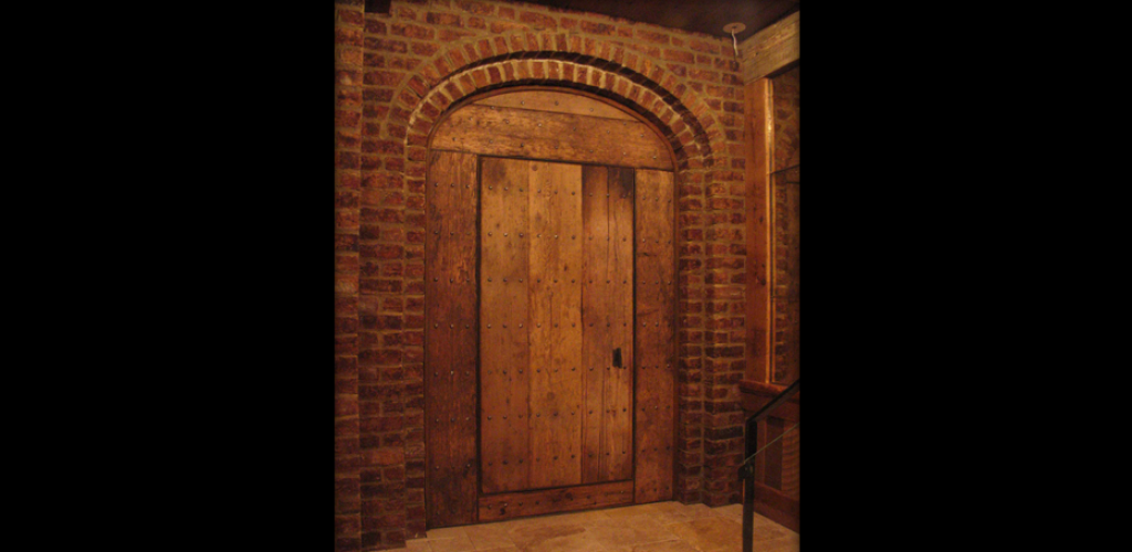 Rustic door fabricated from reclaimed New England barn flooring